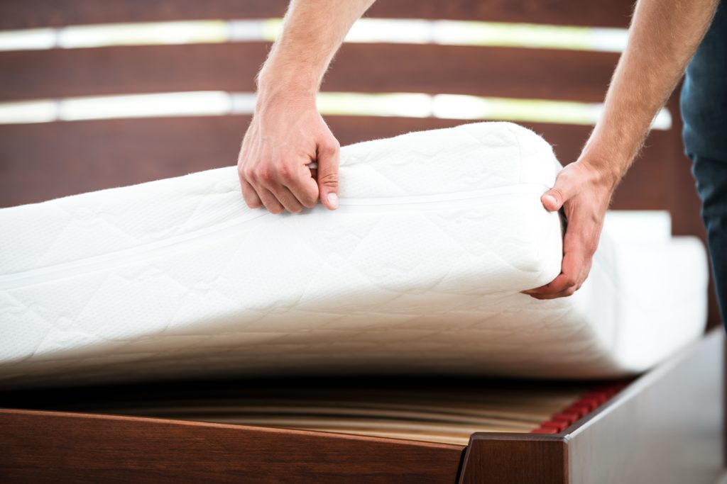 Old mattress during mattress removal services in Connecticut