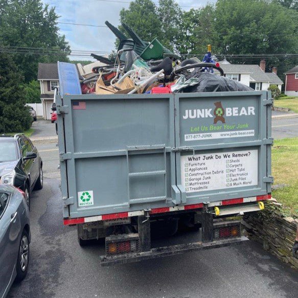 Junk removal truck filled with unwanted junk