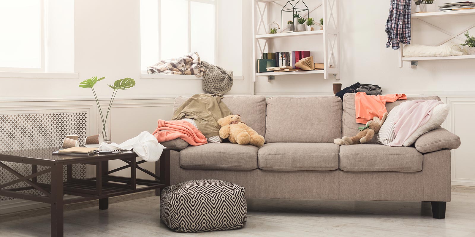 How to get rid of a couch - Junk Bear team carrying an old sofa out of a home for furniture removal